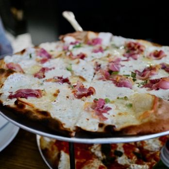 Juliana's - No. 1 Pizza: Mozzarella, Scamorza affumicata, **pancetta** (Italian bacon) and scallions-no - Pizza Near Me - Brooklyn, New York Juliana's - No. 1 Pizza: Mozzarella, Scamorza affumicata, **pancetta** (Italian bacon) and scallions-no - Pizza Near Me - Brooklyn, New York