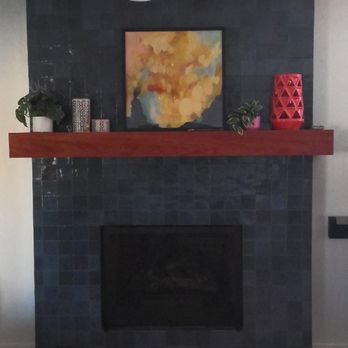 Caldwell Construction - Before, this fireplace was lava rock half the way up the wall, with a hearth. They built the custom mantel for us. - General Contractors Near Me - Sacramento, California