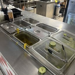 Nasty there's no salsa and a bunch of flies, cucumbers thrown on the floor bunch of empty containers,