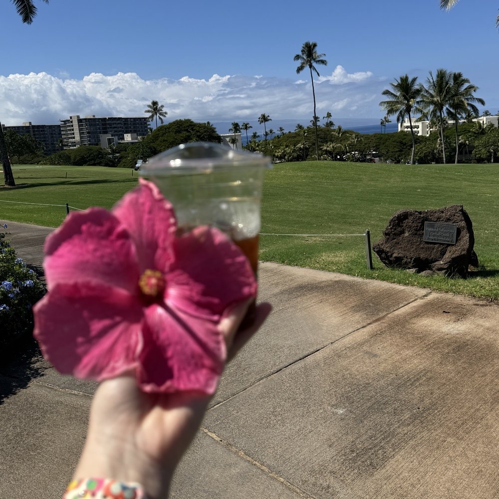 Iced americano + flower picked up on walk back Iced americano + flower picked up on walk back