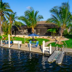 Royal Palms Vacation Rentals - 44 ft concrete dock with free shore power and water for your vessel with NO bridges so perfect for perfect sailboat docking ! kayak launcher