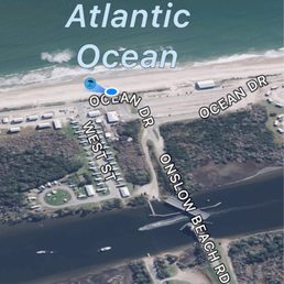 An overview of Onslow Beach via Googlemaps showing RV campsites and lodges to left.