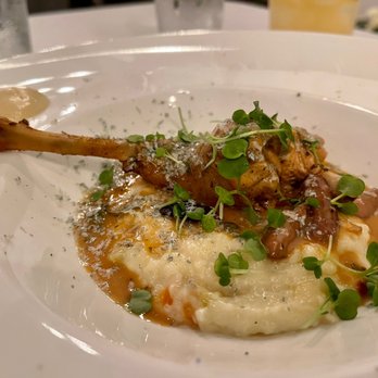 eatMOSAIC - Olive & rosemary braised rabbit leg - polenta "chowder", roasted garlic, shaved blue cheese - New American Near Me - St. James, New York eatMOSAIC - Olive & rosemary braised rabbit leg - polenta "chowder", roasted garlic, shaved blue cheese - New American Near Me - St. James, New York