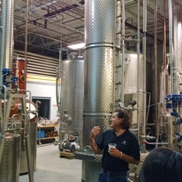 Esteban in front of the distillery equipment Esteban in front of the distillery equipment