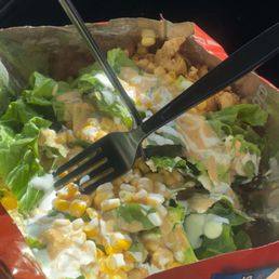 Doritos nacho cheese chips(we brought our own) - they added cheese, chicken, corn, salad, sour cream, house sauce & guac on the side!