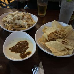 Our appetizers. Queso con chili, and garlic parmesan aioli fries. Our appetizers. Queso con chili, and garlic parmesan aioli fries.