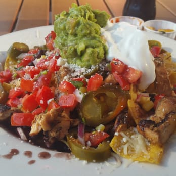Pecado Bueno - Can you tell there are nachos under there? - Mexican Near Me - Seattle, Washington
