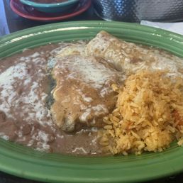 Chicken enchilada and Chile relleno with rice and beans Chicken enchilada and Chile relleno with rice and beans
