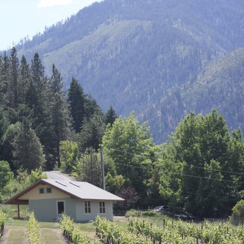Usurious Wines - a vineyard with a house in the background - Wine Tasting Room Near Me - Leavenworth, Washington Usurious Wines - a vineyard with a house in the background - Wine Tasting Room Near Me - Leavenworth, Washington
