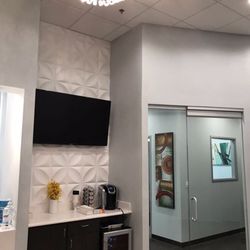 Dental Studio 121 - Beverage area & TV in waiting area