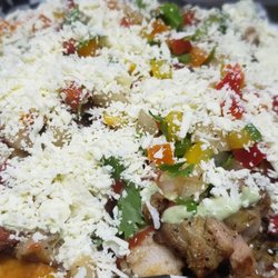 El Coplero Food - Ternerita. French fries, picanha,  chicken,  ketchup,  green sauce, pico de gallo and cheese.