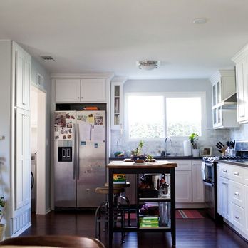HYB Construction - a kitchen with white cabinets and wood floors - General Contractors Near Me - Lakewood, California HYB Construction - a kitchen with white cabinets and wood floors - General Contractors Near Me - Lakewood, California