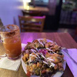 Steak nachos and michelada