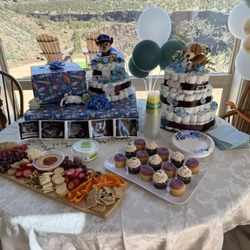 Ida’s Cupcake Cafe - chocolate cupcakes w/ toasted coconut frosting and vanilla cupcakes w/ marionberry cream cheese frosting for my baby shower!