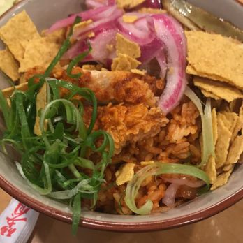 Bunker21 - Spicy fried chicken on top of kimchi fried rice. Kind of weirded out by the tortilla chips but a great contrast in textures! - Korean Near Me - Artesia, California