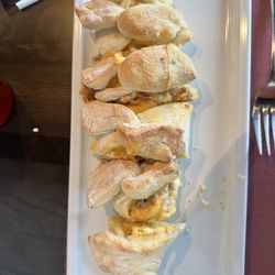Lottie's Cafe - Breakfast Stromboli - eggs, sausage gravy, cheddar cheese + bacon