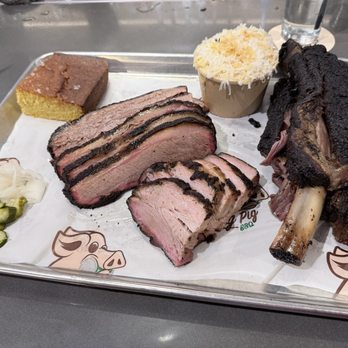 Drinking Pig BBQ - Corn Bread, Brisket, Pork Belly, Mac & Cheese, and Beef Rib (left to right) - Barbeque Near Me - Miami, Florida Drinking Pig BBQ - Corn Bread, Brisket, Pork Belly, Mac & Cheese, and Beef Rib (left to right) - Barbeque Near Me - Miami, Florida