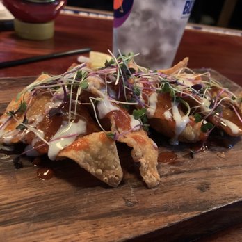 Tap Room - The dragon wonton appetizer. Chicken stuffed and topped with a bunch of whacky sauces. - Bars Near Me - Patchogue, New York Tap Room - The dragon wonton appetizer. Chicken stuffed and topped with a bunch of whacky sauces. - Bars Near Me - Patchogue, New York