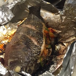 Red's Fish Heads - In English: popped tilapia. Very tasty and served well.