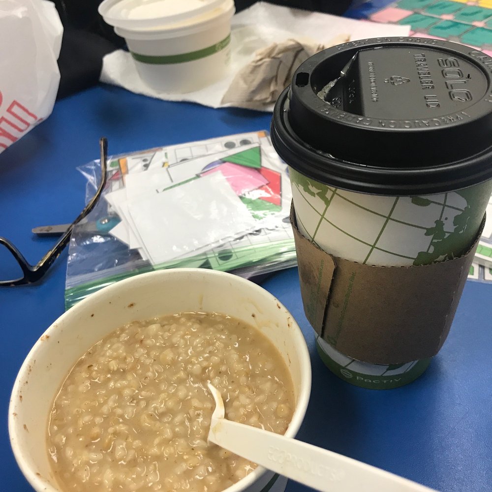 a bowl of oatmeal and a cup of coffee