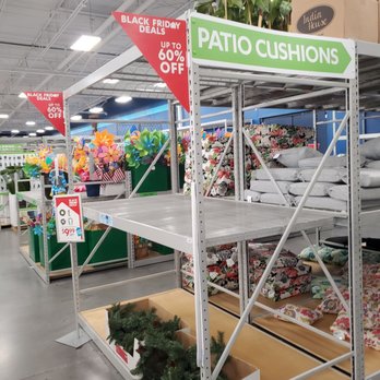 At Home - Section with a arrow pointing to patio cushions with a red sign that says Black Friday deals up to 60% off! - Home Decor Near Me - Tempe, Arizona