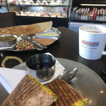 Remedy Cafe - Masala dosa in the back, butter chicken wrap in the foreground. - Indian Near Me - Edmonton, Alberta