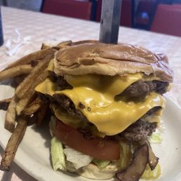Triple Cheeseburger w/ sautéed onions and fixins.
