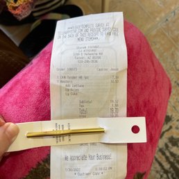 a receipt and a pencil a receipt and a pencil