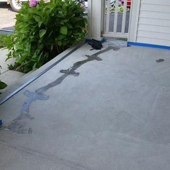 Quick Fix Waterproofing - This patio was severely cracked and required staples to be installed before decorative coating applied. - Masonry/Concrete Near Me - Island Lake, Illinois Quick Fix Waterproofing - This patio was severely cracked and required staples to be installed before decorative coating applied. - Masonry/Concrete Near Me - Island Lake, Illinois