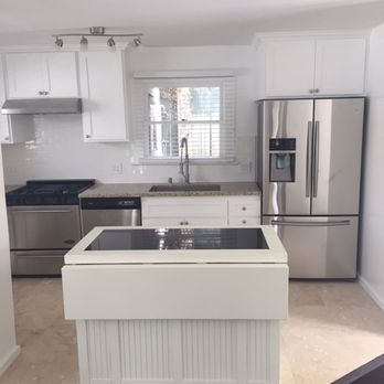 TD Restoration - a kitchen with white cabinets and stainless steel appliances - Damage Restoration Near Me - Los Angeles, California TD Restoration - a kitchen with white cabinets and stainless steel appliances - Damage Restoration Near Me - Los Angeles, California