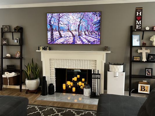 Fireplace TV Mounting - We installed this TV over the decorated fireplace and added in-ceiling surround sound speakers for a finish invisible surround sound look. Fireplace TV Mounting - We installed this TV over the decorated fireplace and added in-ceiling surround sound speakers for a finish invisible surround sound look.