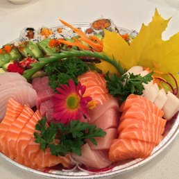 Custom tray: small sashimi, green dragon, black dragon and spicy tuna rolls. Custom tray: small sashimi, green dragon, black dragon and spicy tuna rolls.