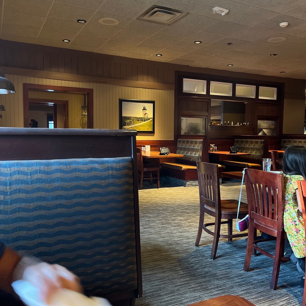 Red Lobster - a woman sitting at a table in a restaurant - Seafood Near Me - Aurora, Colorado Red Lobster - a woman sitting at a table in a restaurant - Seafood Near Me - Aurora, Colorado