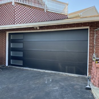 Park Ave Doors & Gates - Beautiful flush door with side windows, fully insulated, torsion system and a lifetime warranty against corrosion. - Garage Door Services Near Me Park Ave Doors & Gates - Beautiful flush door with side windows, fully insulated, torsion system and a lifetime warranty against corrosion. - Garage Door Services Near Me