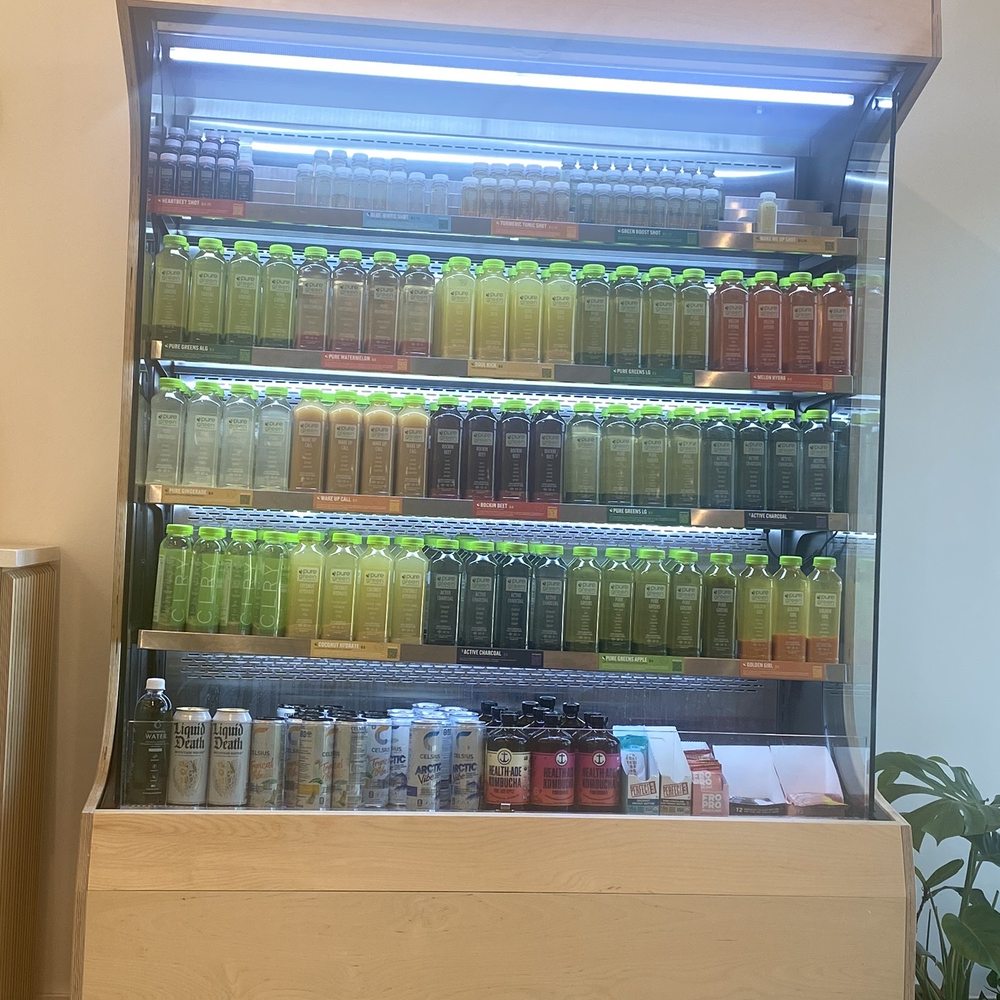 Pure Green - Juice wall - Juice Bars & Smoothies Near Me - Aventura, Florida