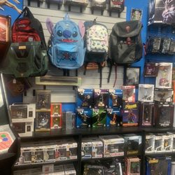 Krum's World Comics and Collectible - Some of their backpacks and Funkos