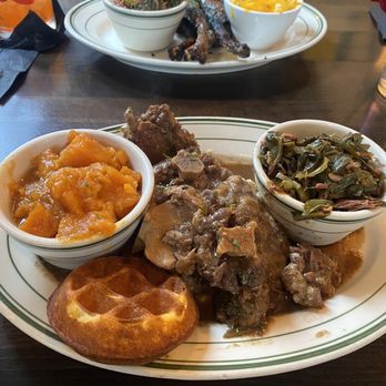 Taste Kitchen Bar - Oxtails over garlic mashed potatoes, yams and greens - Breakfast & Brunch Near Me - Houston, Texas Taste Kitchen Bar - Oxtails over garlic mashed potatoes, yams and greens - Breakfast & Brunch Near Me - Houston, Texas