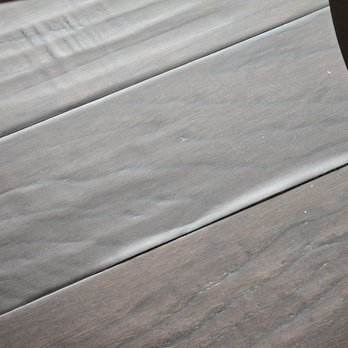 Apple Tree - HARDWOOD FLOOR CUPPING AND LIFTING OFF OF SUBFLOOR. - Home Developers Near Me - Bellevue, Wisconsin
