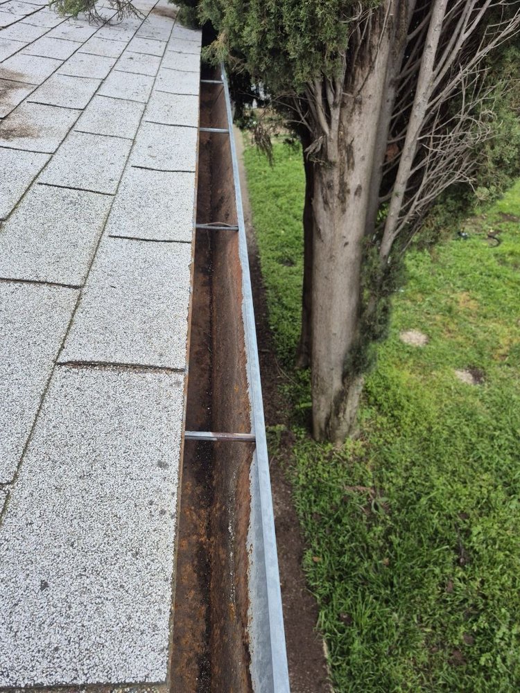 Slide of Cleaning Gutters Service