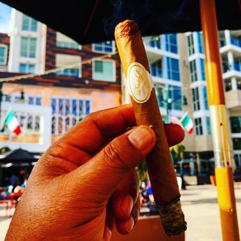 Royal Cigar Lounge - a hand holding a cigar - Lounges Near Me - San Diego, California Royal Cigar Lounge - a hand holding a cigar - Lounges Near Me - San Diego, California