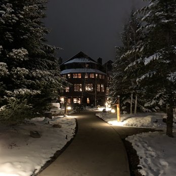 Kanu - a pathway leading to a lodge at night - New American Near Me - Lake Placid, New York Kanu - a pathway leading to a lodge at night - New American Near Me - Lake Placid, New York