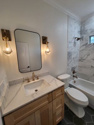 Modern Bathroom Remodel - This homeowner wanted a fresh, modern bathroom that felt brighter, cleaner, and more functional. We remodeled the entire space from top to bottom — updating the vanity, replacing outdated fixtures, installing new lighting, refreshing the flooring, and giving the whole room an elevated, cohesive look.
Our team handled everything from demolition to final detailing. The result is a clean, modern bathroom that feels bigger, brighter, and built to last.
If you’re looking to update your bathroom, increase your home value, or give your space a brand-new feel, we can help. We specialize in quality craftsmanship, fast turnaround, and clear communication from start to finish. Modern Bathroom Remodel - This homeowner wanted a fresh, modern bathroom that felt brighter, cleaner, and more functional. We remodeled the entire space from top to bottom — updating the vanity, replacing outdated fixtures, installing new lighting, refreshing the flooring, and giving the whole room an elevated, cohesive look.
Our team handled everything from demolition to final detailing. The result is a clean, modern bathroom that feels bigger, brighter, and built to last.
If you’re looking to update your bathroom, increase your home value, or give your space a brand-new feel, we can help. We specialize in quality craftsmanship, fast turnaround, and clear communication from start to finish.