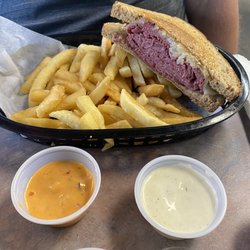 Key West Sandwich Shop - Reuben sandwich and fries served with a side of thousand island and their special dipping sauce.
