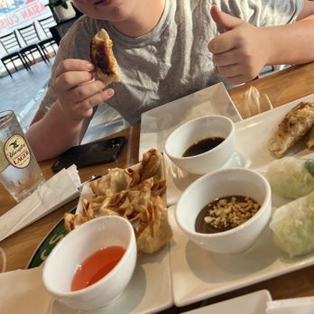 Pho City - a boy eating a meal at a restaurant - Sports Bars Near Me - Methuen, Massachusetts Pho City - a boy eating a meal at a restaurant - Sports Bars Near Me - Methuen, Massachusetts