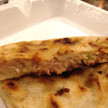 Sabrositas Pupusas & Beer - Cross section of a Pupusa Revuelta - Salvadoran Near Me - Van nuys, California Sabrositas Pupusas & Beer - Cross section of a Pupusa Revuelta - Salvadoran Near Me - Van nuys, California