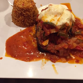 Zizi's Cafe - Eggplant tower with couscous. - Mediterranean Near Me - Chicago, Illinois Zizi's Cafe - Eggplant tower with couscous. - Mediterranean Near Me - Chicago, Illinois