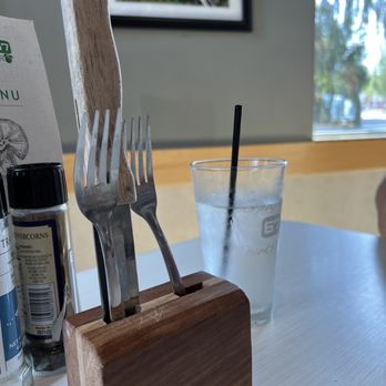 Kitchen 67 - Communal cutlery... your knife and fork are just hanging out in the open air, stuck into this unwashed block of wood - New American Near Me - Grand Rapids, Michigan
