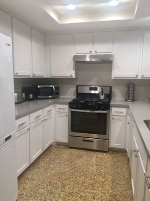 Kitchen Cabinet Refacing Project - Kitchen Cabinet Refacing with white RTF (Rigid Thermofoil)

This kitchen was quite dark, and the customer wanted to lighten things up a bit, as well as add new appliances and countertops.