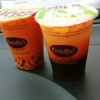 Bambu - Thai tea with pandan jelly. To the left is mixed. To the right is unmixed. - Juice Bars & Smoothies Near Me - Millbrae, California Bambu - Thai tea with pandan jelly. To the left is mixed. To the right is unmixed. - Juice Bars & Smoothies Near Me - Millbrae, California