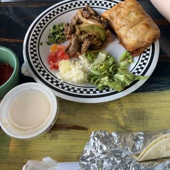Juan's Mexican Grill Express - Chimichanga and taco fixings from buffet bar. Salsa and cheese dip come in the price of bar. - Mexican Near Me - Poplarville, Mississippi